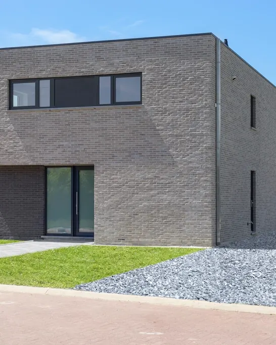 Brick school extension with tall windows